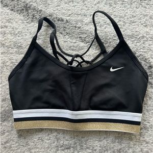 Nike sports bra black with gold and white stripes used once size small